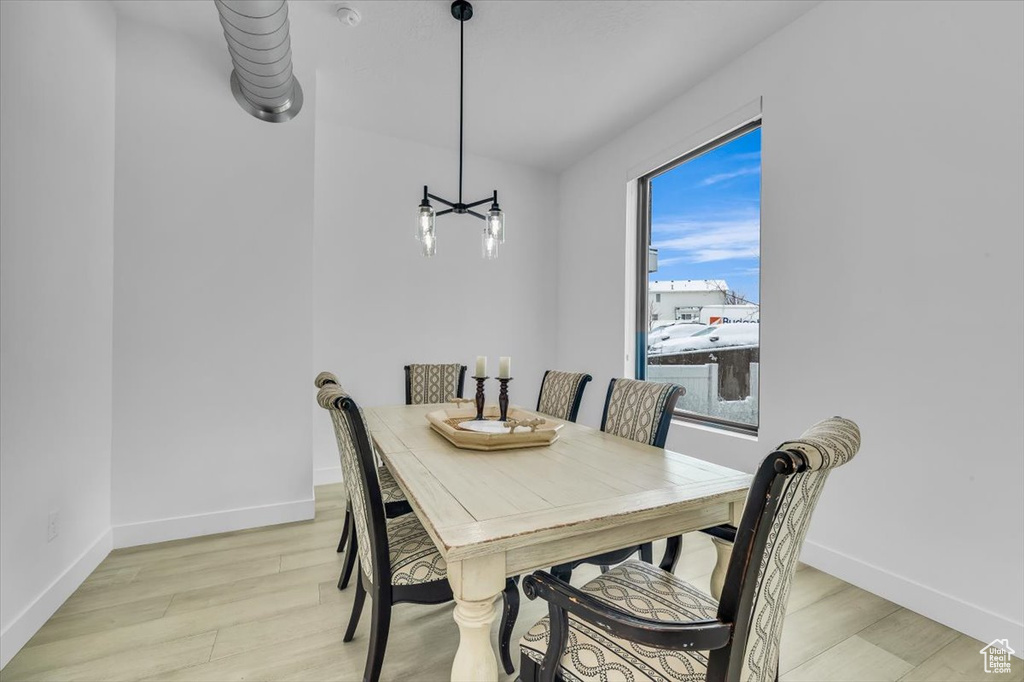 Dining space featuring light wood-style floors and baseboards