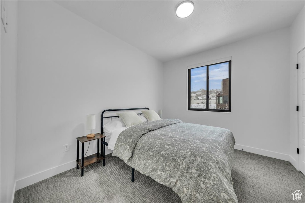 Carpeted bedroom with baseboards