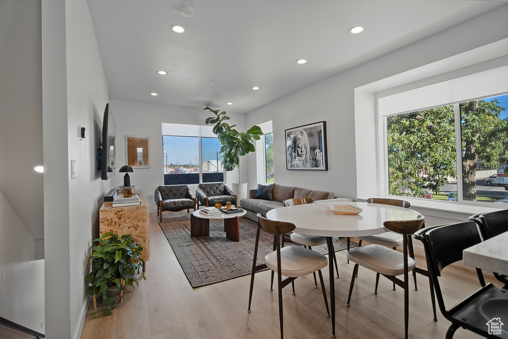 Dining area featuring a wealth of natural light and light hardwood / wood-style floors