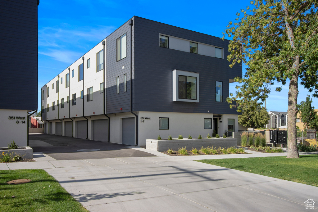 View of building exterior featuring a garage