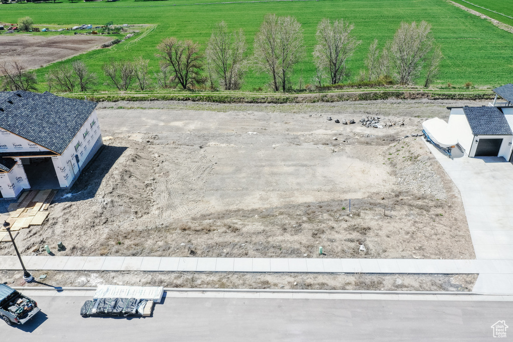 Birds eye view of property featuring a rural view