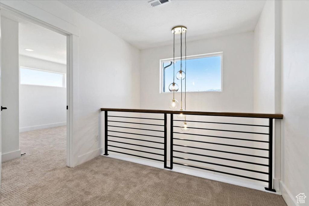Interior space featuring light colored carpet