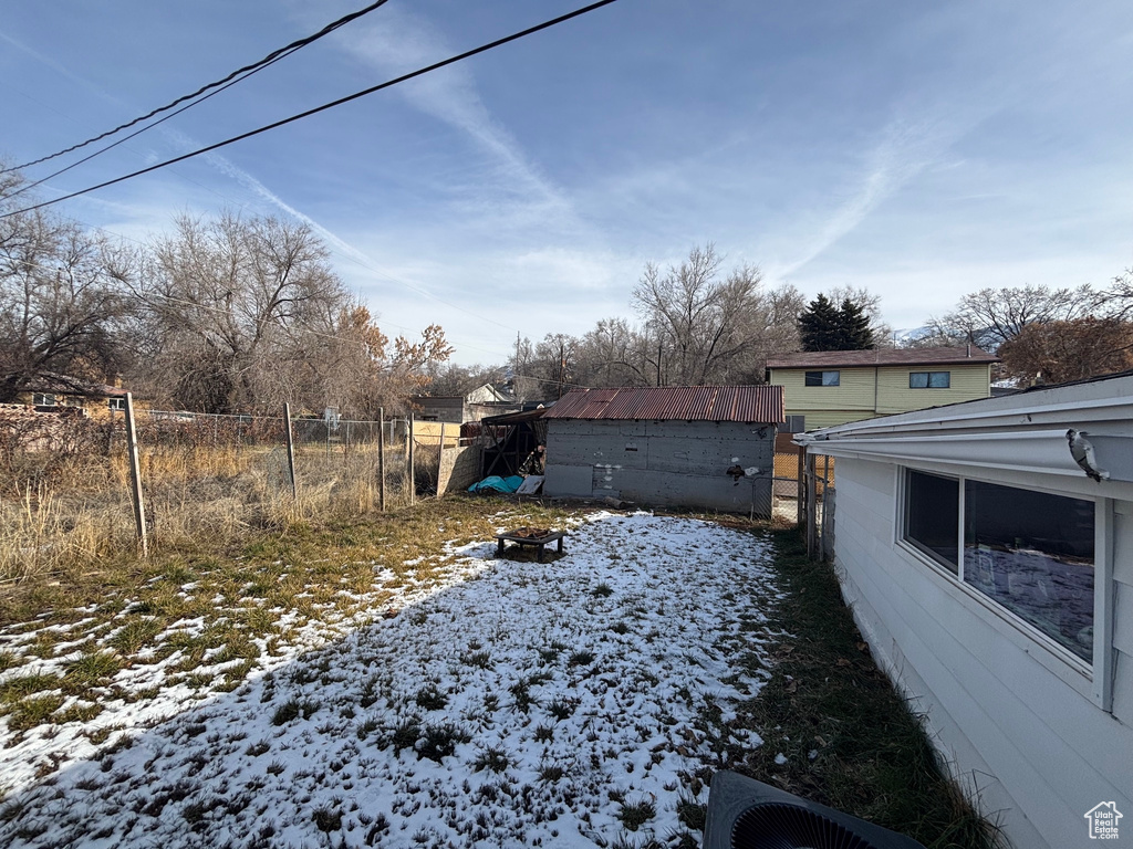 View of yard covered in snow