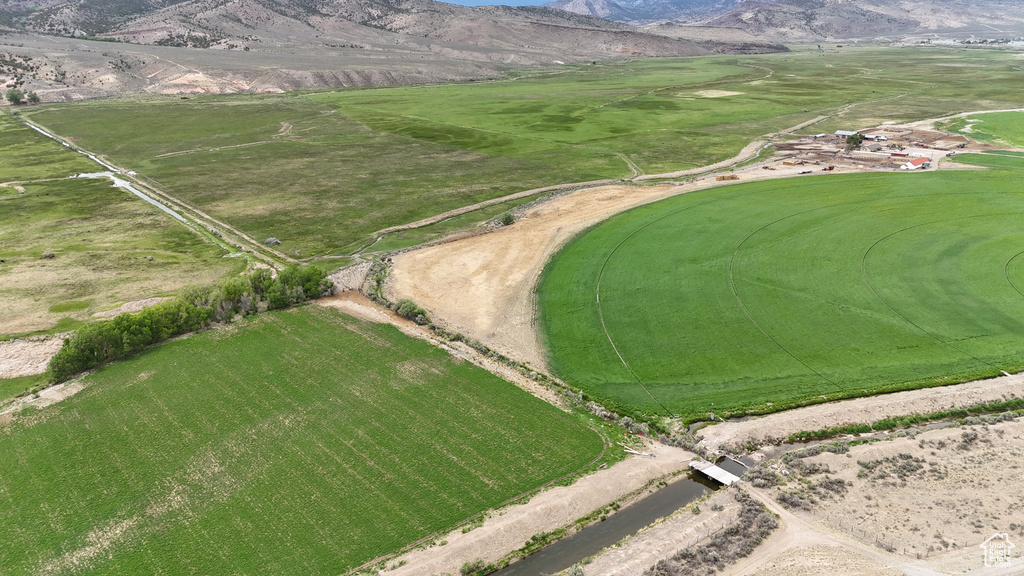 Aerial view of sparsely populated area with a mountain backdrop