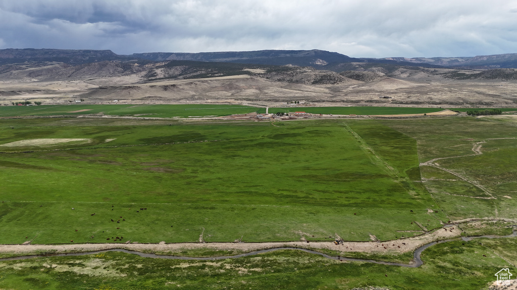 View of mountain backdrop with rural landscape