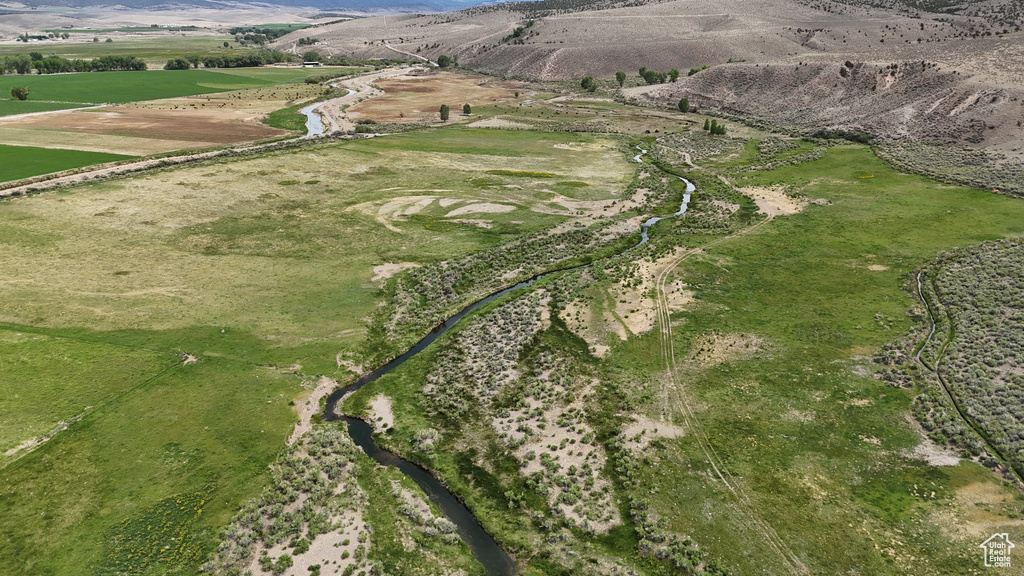 Aerial view of property and surrounding area with mountains
