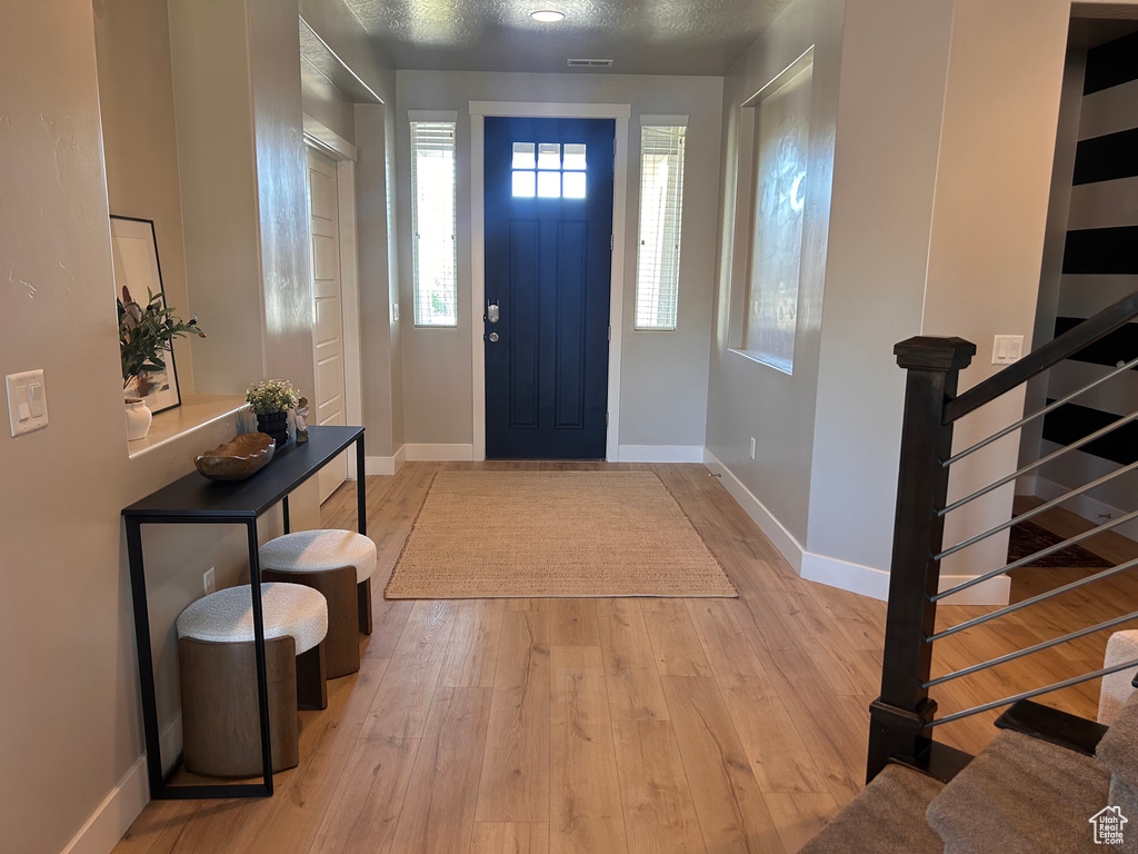 Foyer featuring light hardwood / wood-style floors