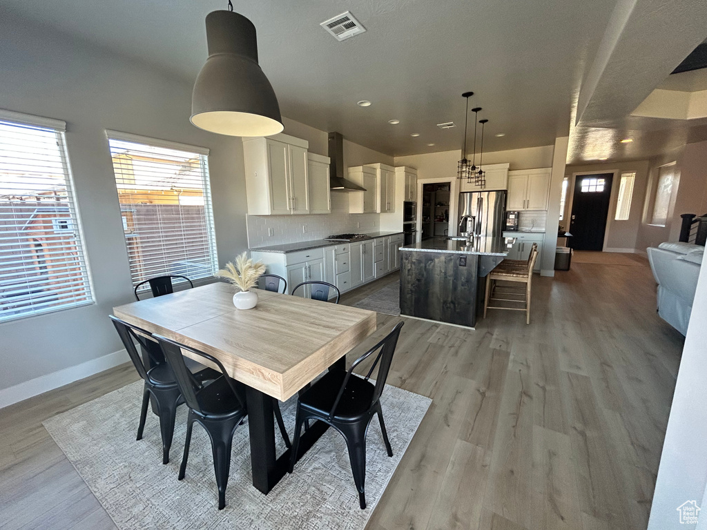 Dining area featuring light hardwood / wood-style floors