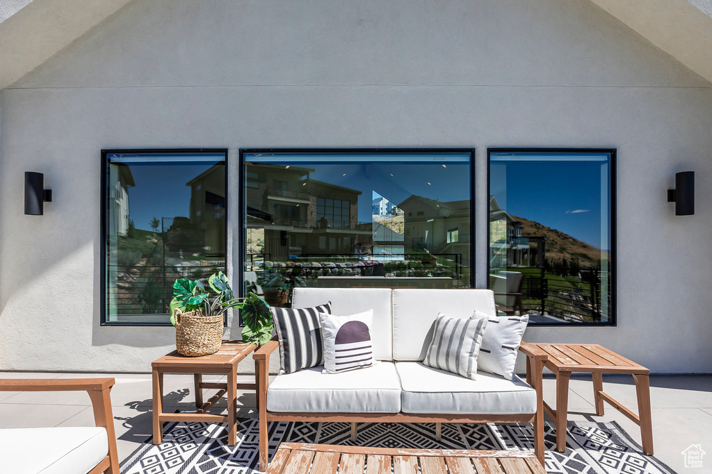 View of patio featuring an outdoor hangout area