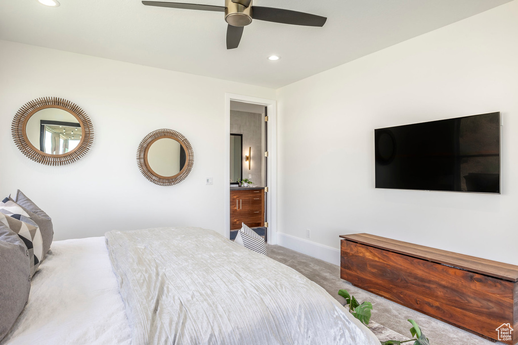 Bedroom featuring light carpet and ceiling fan