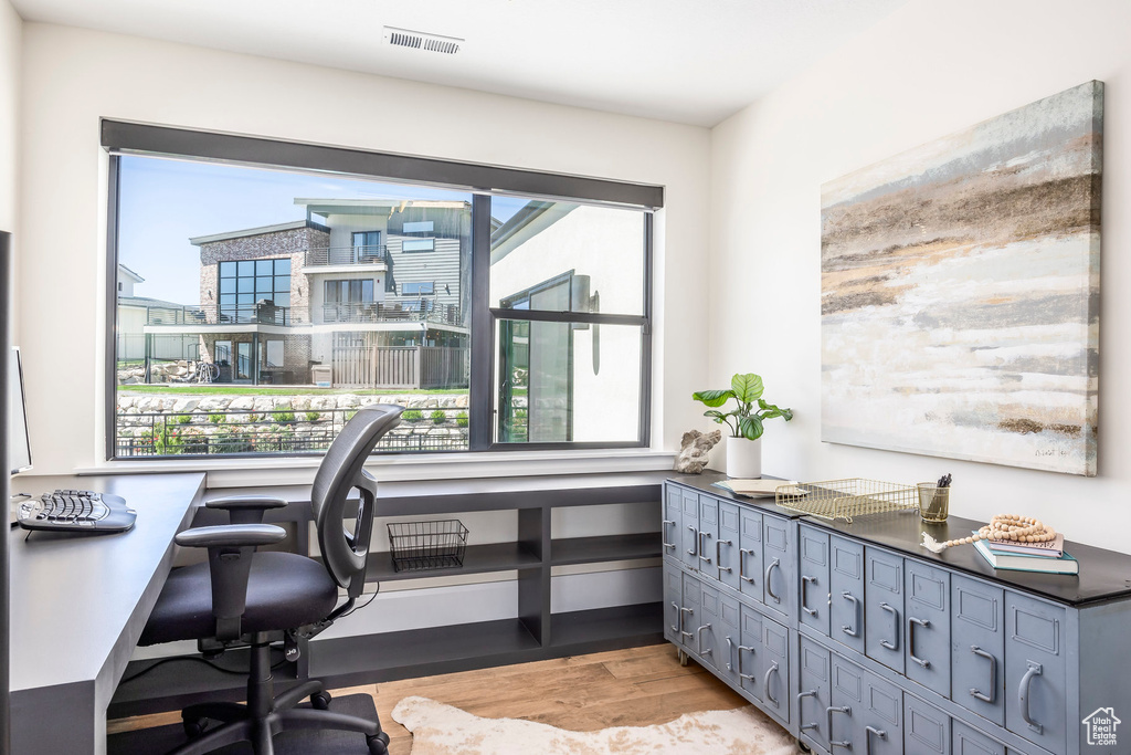 Office space featuring light hardwood / wood-style floors