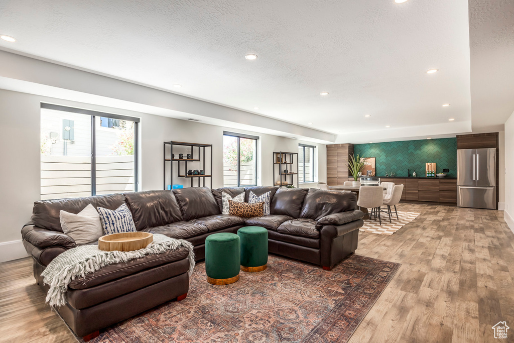 Living room with light wood-type flooring