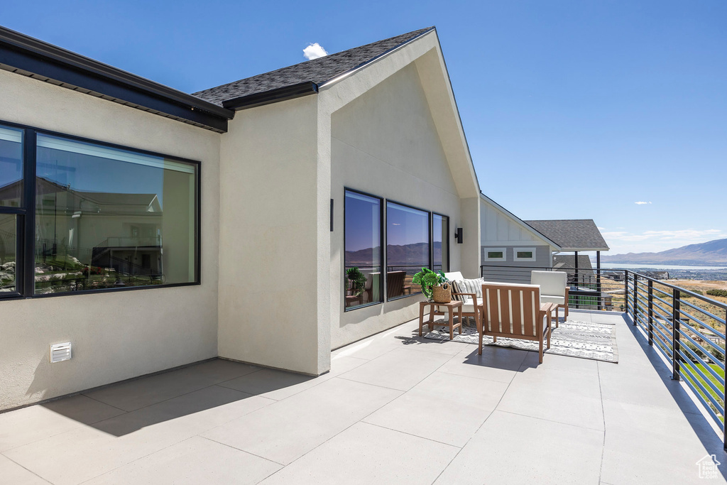 Exterior space featuring a mountain view and a balcony