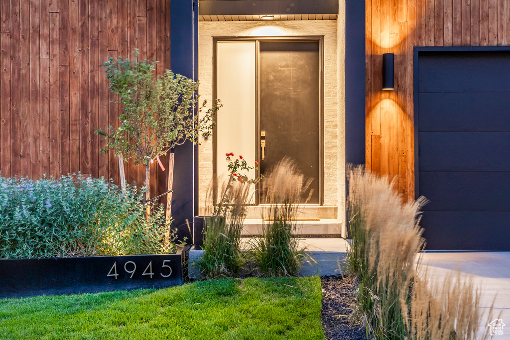 Entrance to property featuring a garage