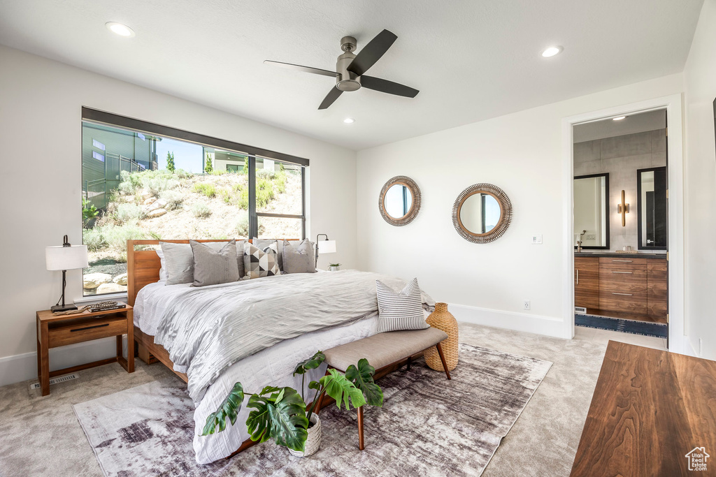 Carpeted bedroom with ceiling fan