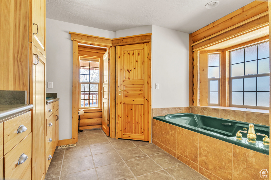 Bathroom with a tub to relax in
