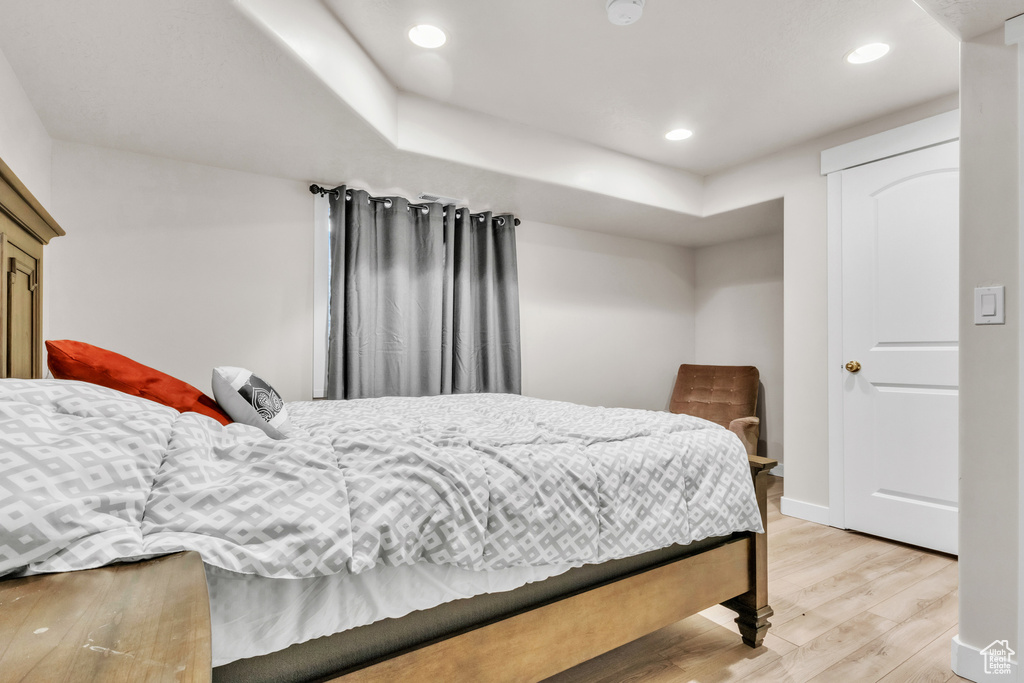Bedroom with light hardwood / wood-style floors