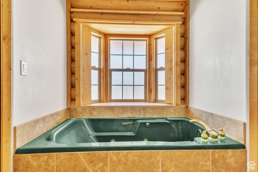 Bathroom with tiled bath