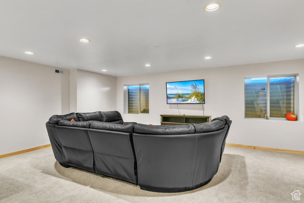 Living room featuring light colored carpet