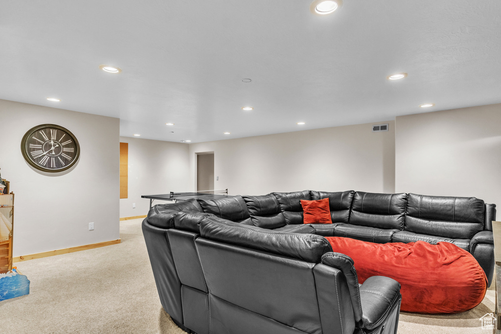Living room featuring light colored carpet