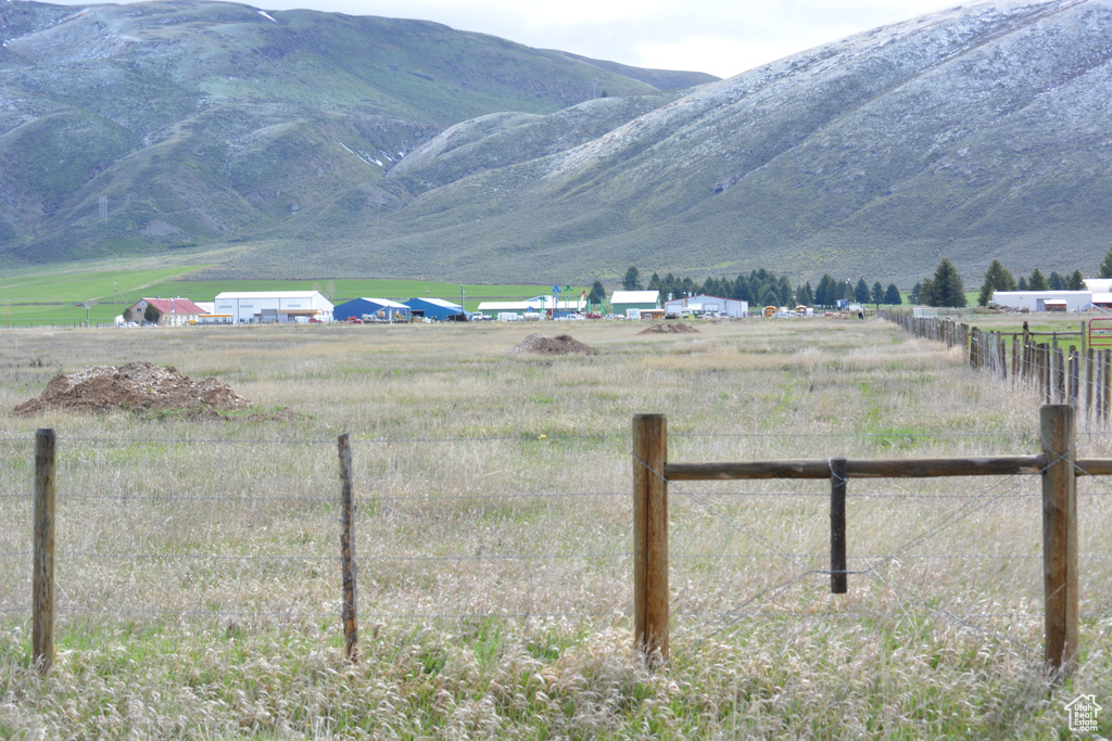 View of mountain backdrop featuring rural landscape