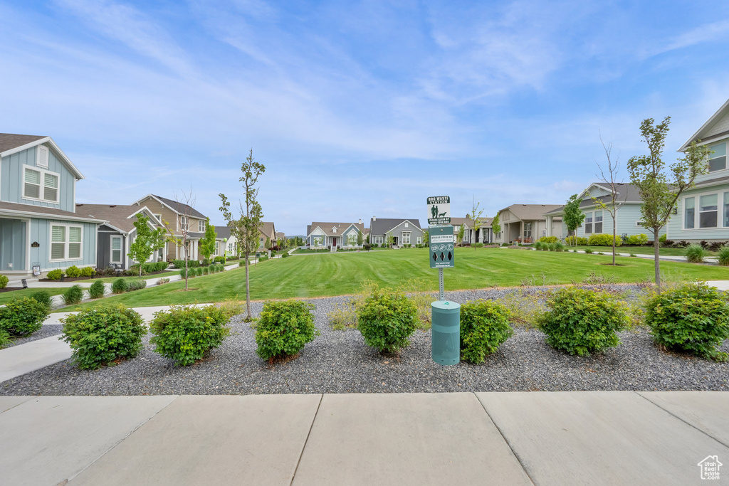 View of home\\\\\\\'s community featuring a residential view and a yard