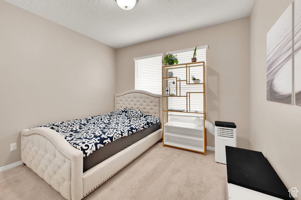 Carpeted bedroom with baseboards