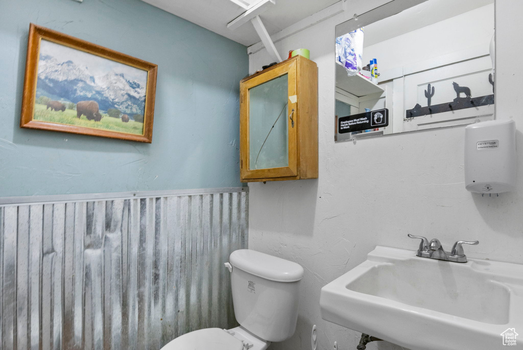 Bathroom with sink and toilet