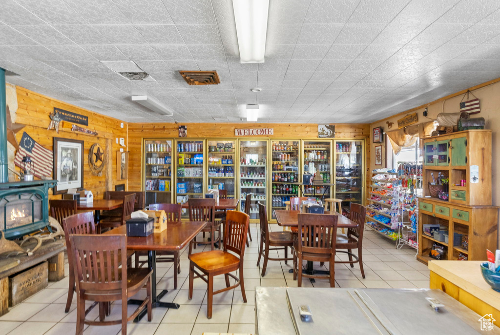 Tiled dining area with wood walls