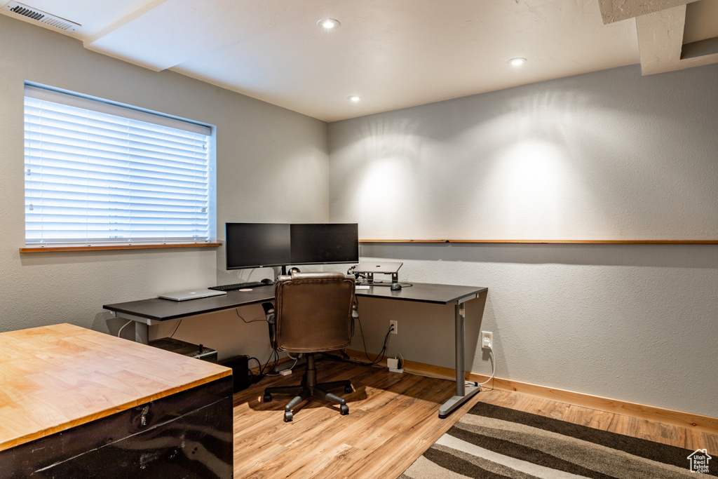 Office space featuring light hardwood / wood-style floors