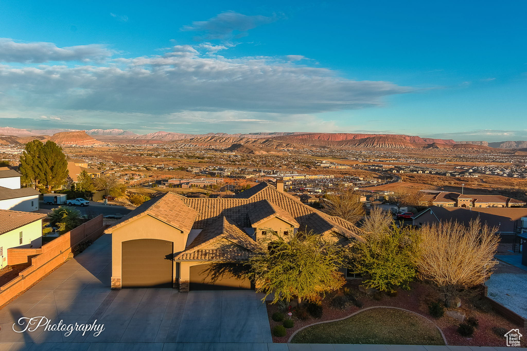 Birds eye view of property with a mountain view