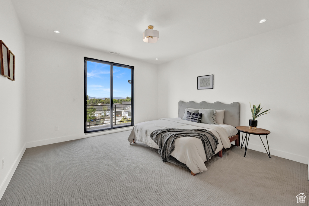 Bedroom with light carpet