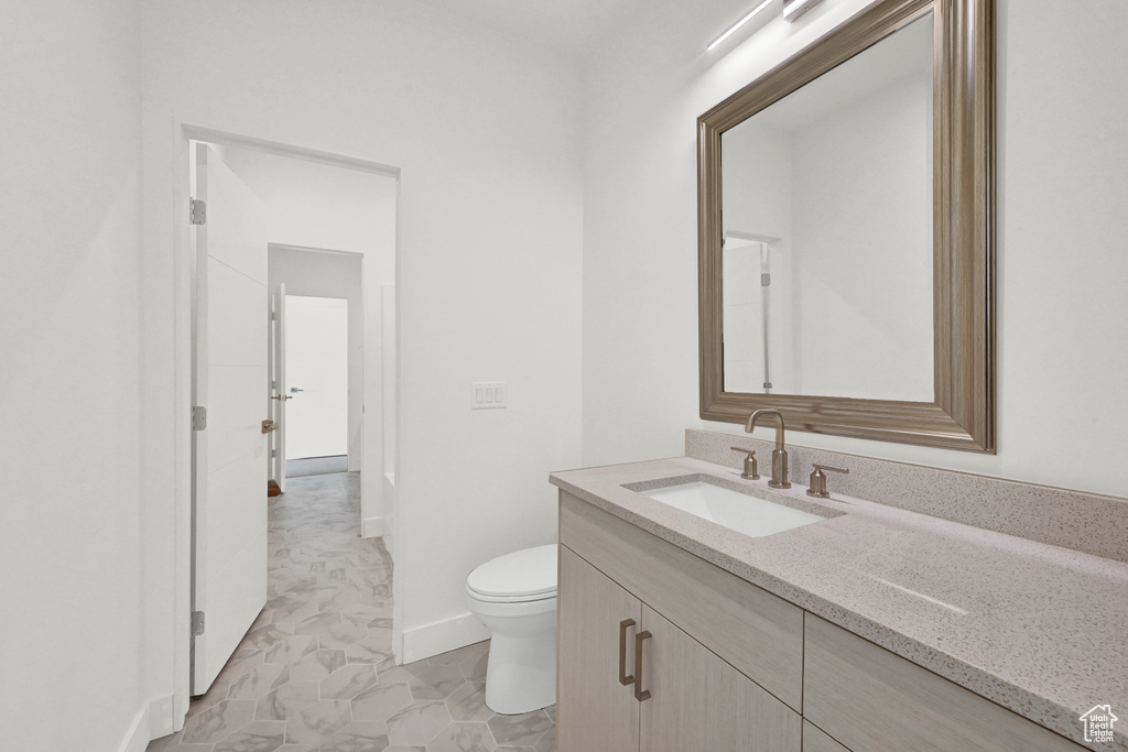 Bathroom with vanity and toilet