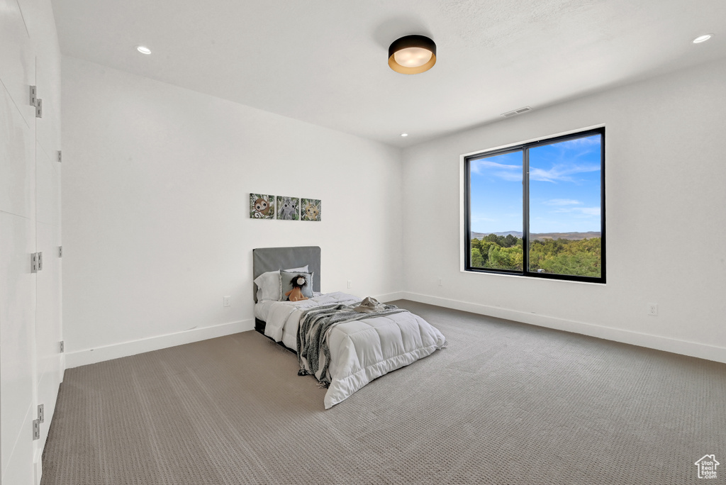 Bedroom featuring carpet flooring