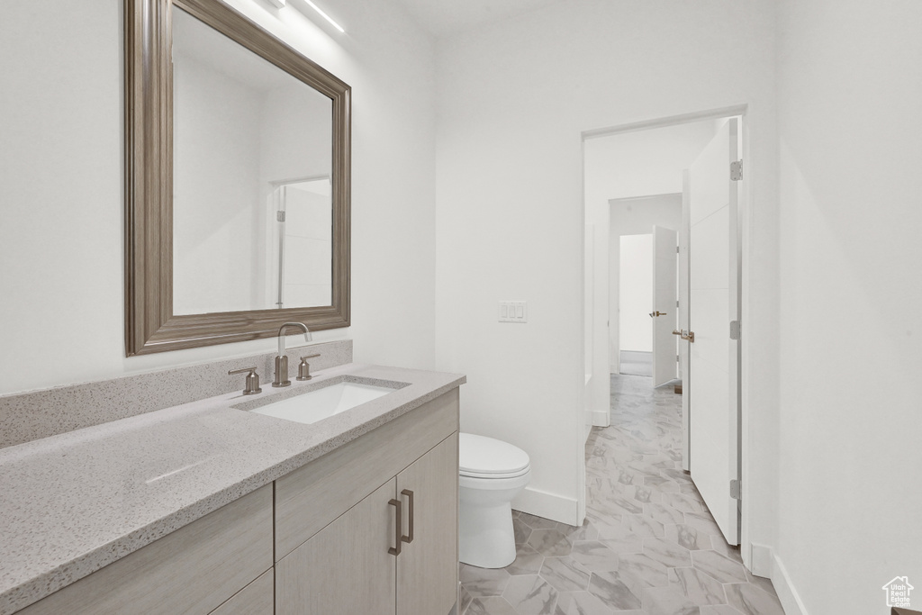 Bathroom with toilet and vanity