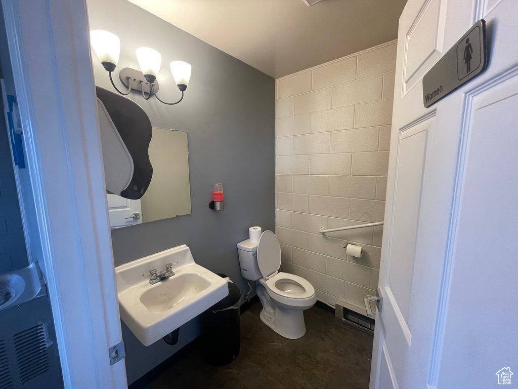 Bathroom featuring sink and toilet