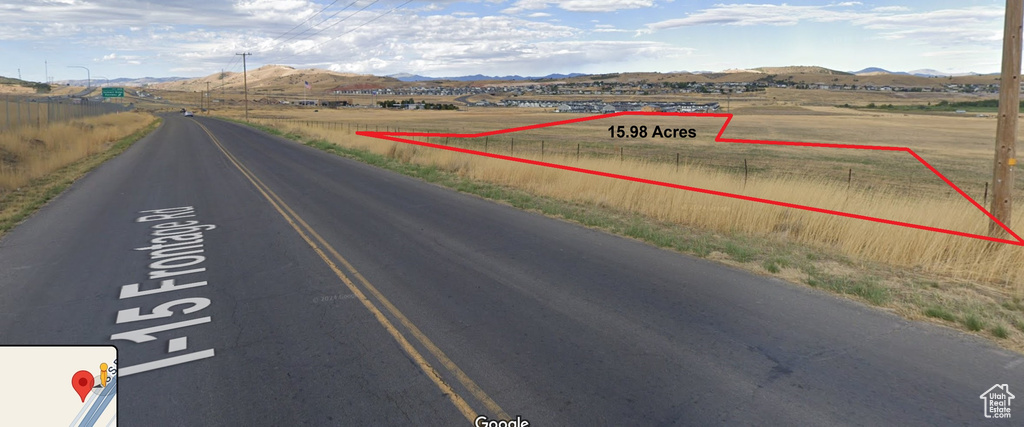 View of street featuring a rural view and a mountain view