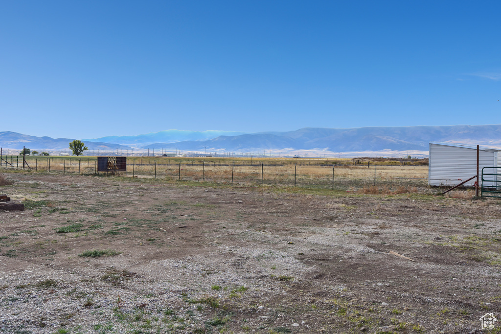 Property view of mountains with a rural view