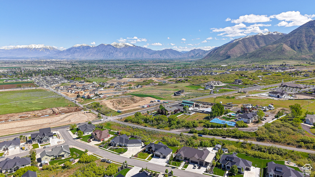 View of property location with mountains and nearby suburban area