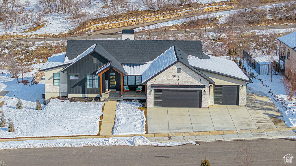 View of front of property featuring a garage