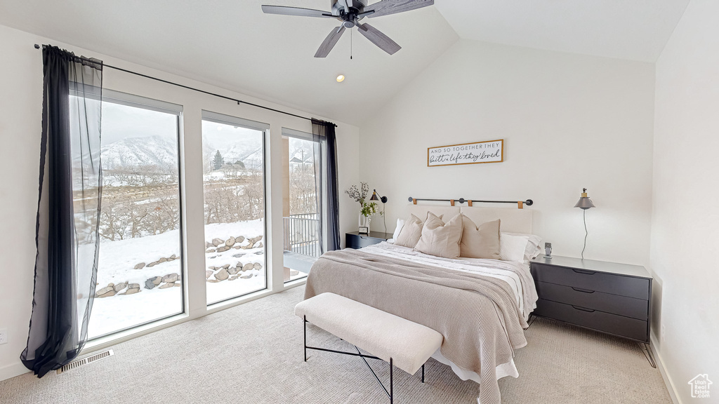 Carpeted bedroom featuring ceiling fan, access to outside, lofted ceiling, and a mountain view