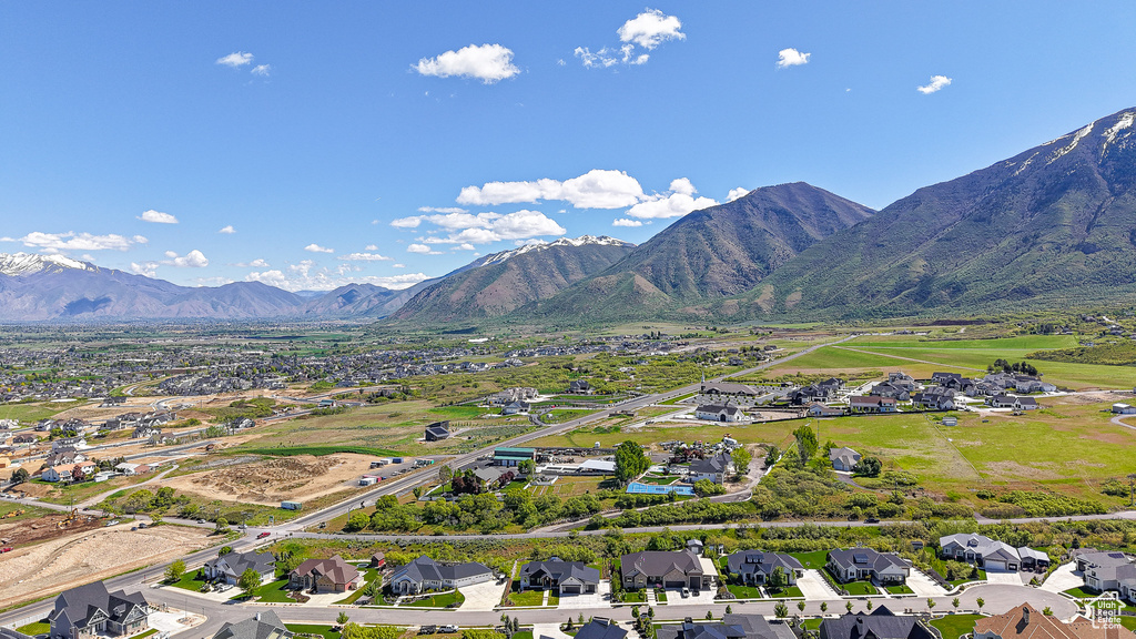Aerial view of residential area featuring a mountainous background
