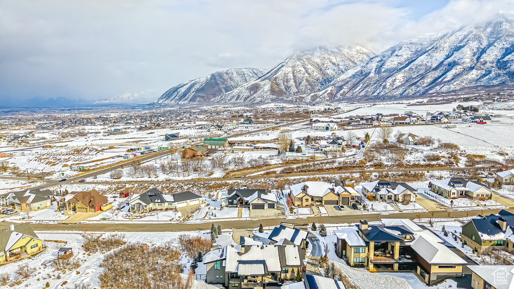 Snowy aerial view featuring a mountain view