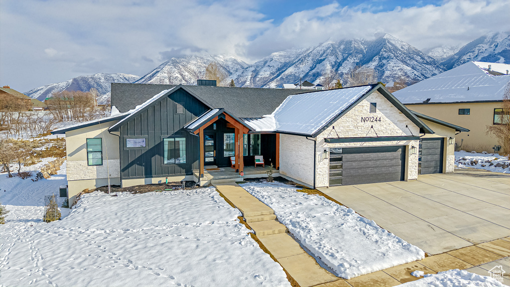 View of front of property with a mountain view