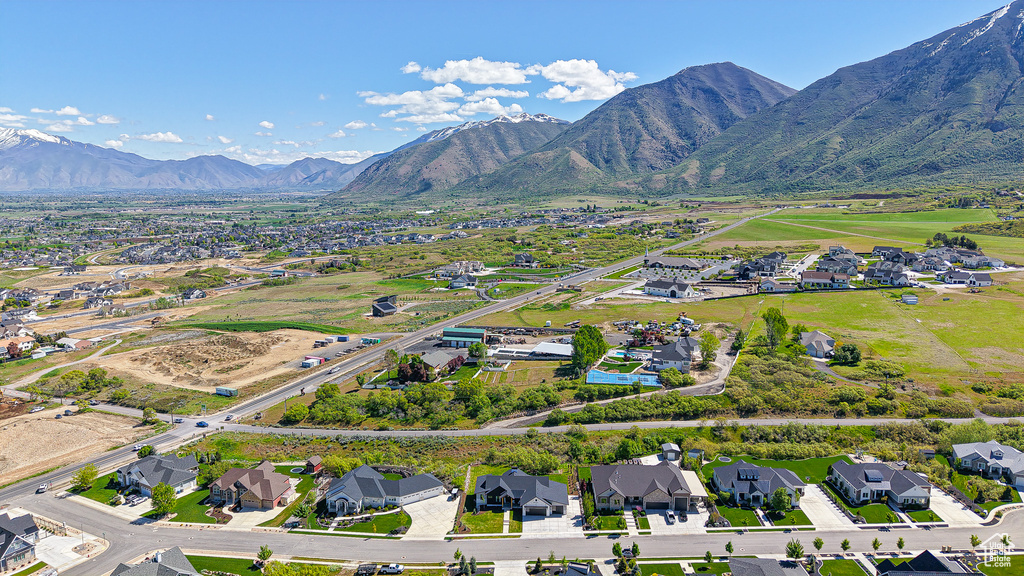 View of property location featuring nearby suburban area and a mountainous background