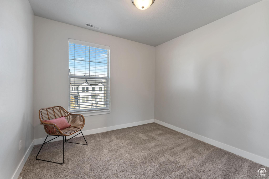 Unfurnished room featuring light colored carpet