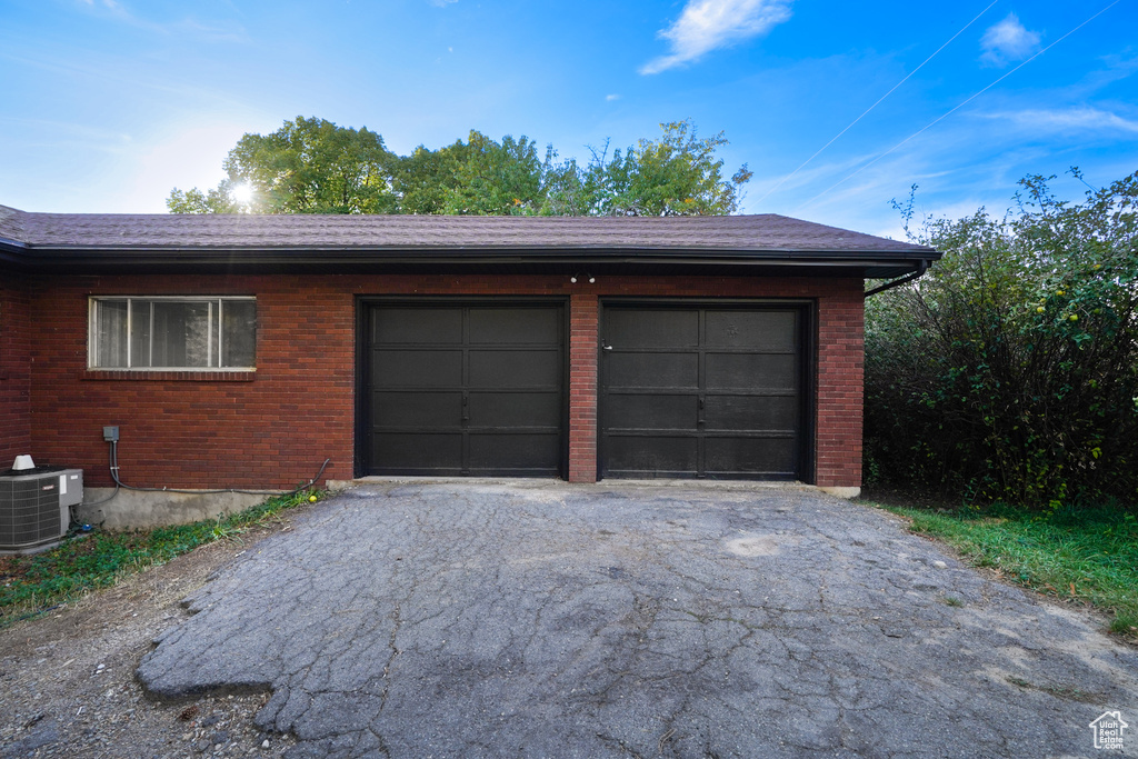 Garage featuring central AC unit