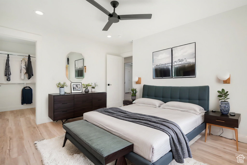 Bedroom featuring ceiling fan and light hardwood / wood-style flooring