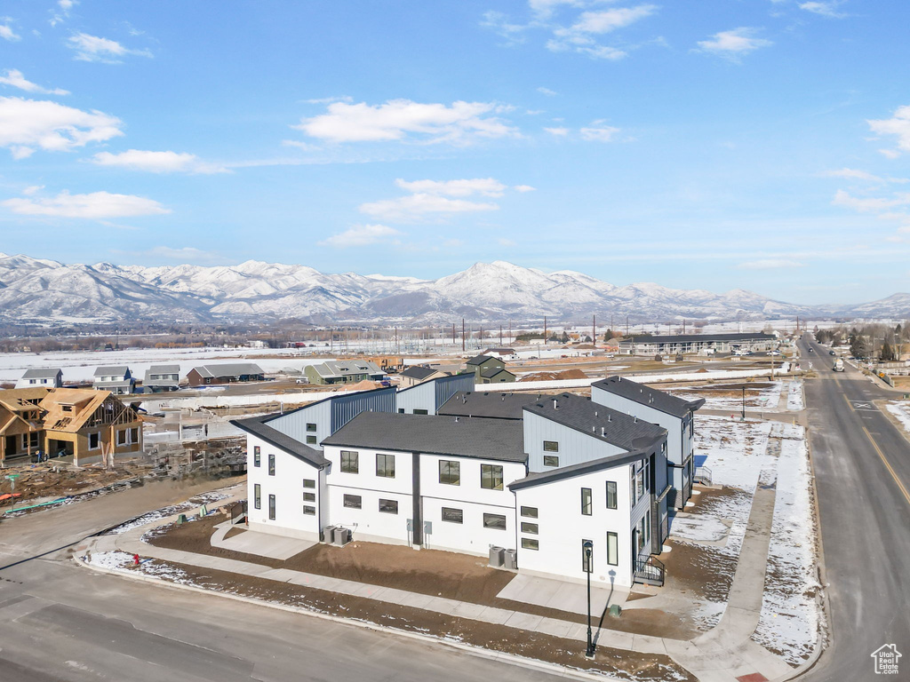 Snowy aerial view featuring a mountain view