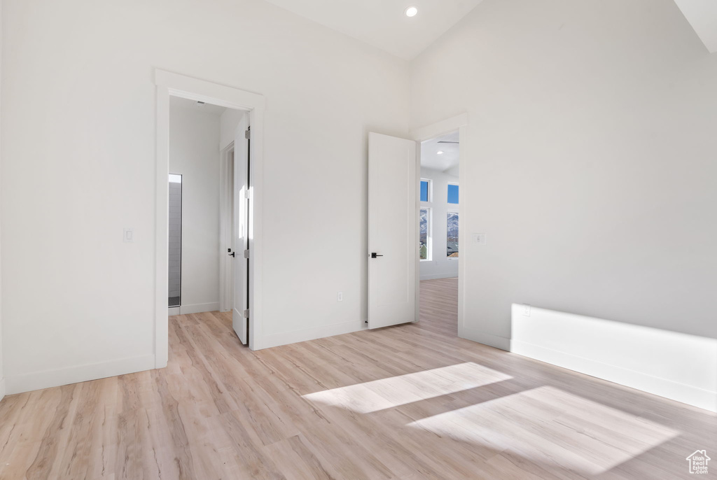 Unfurnished bedroom with light hardwood / wood-style flooring